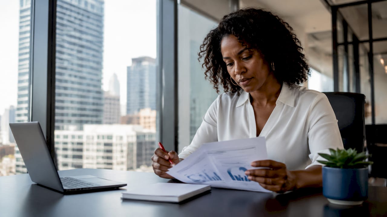 Manager reading employee feedback document