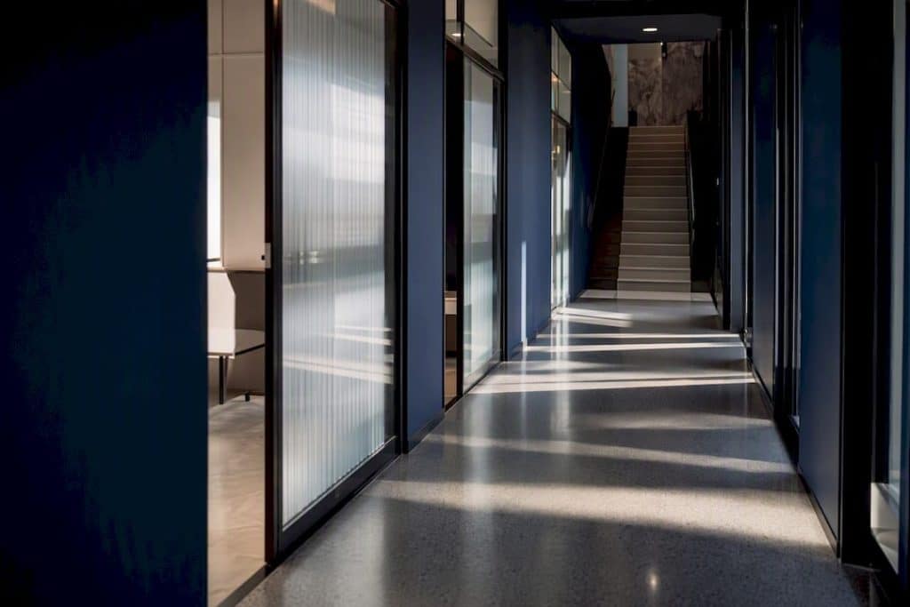 Modern office stairway with shadows and reflections