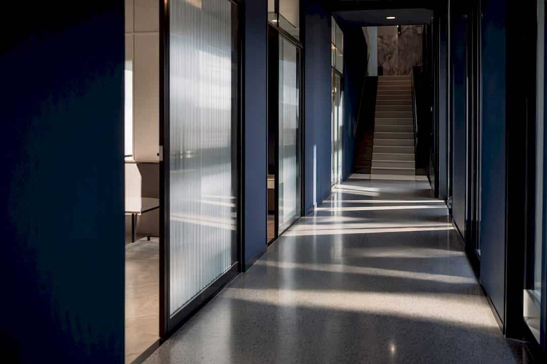Modern office stairway with shadows and reflections