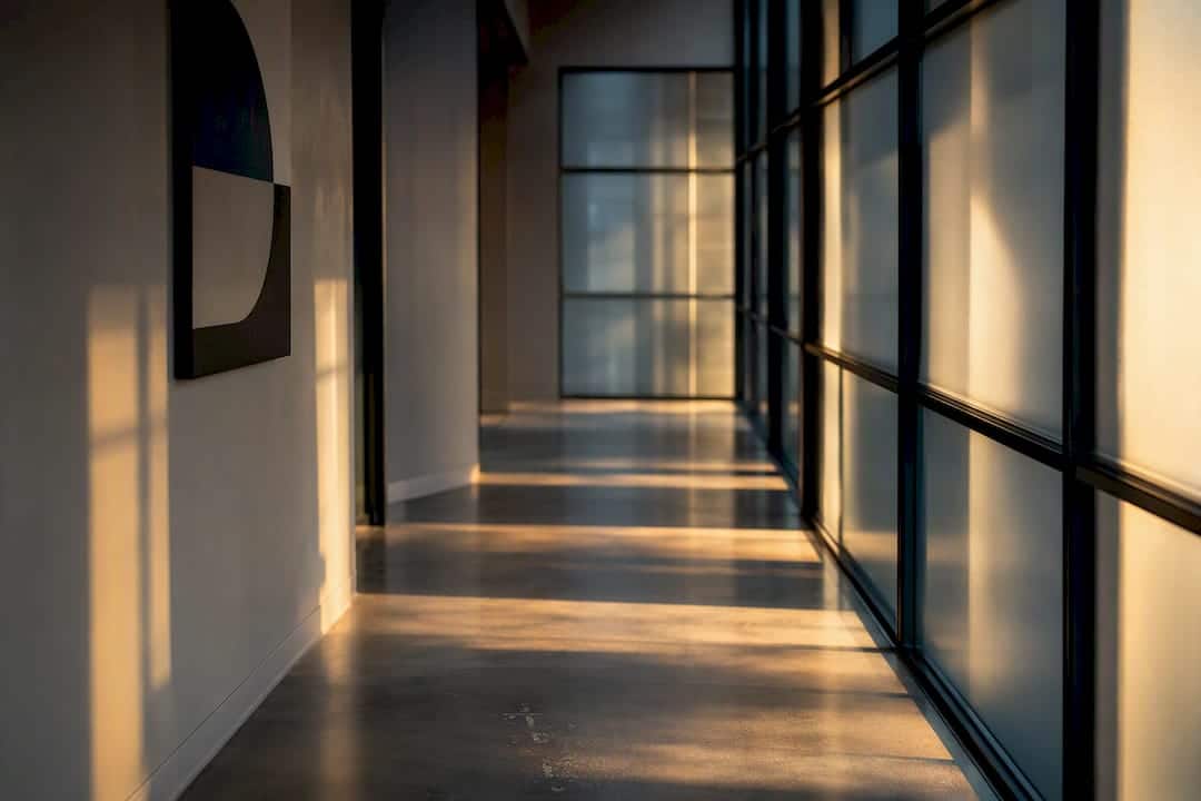 Glass stairway with steel beams and shadows