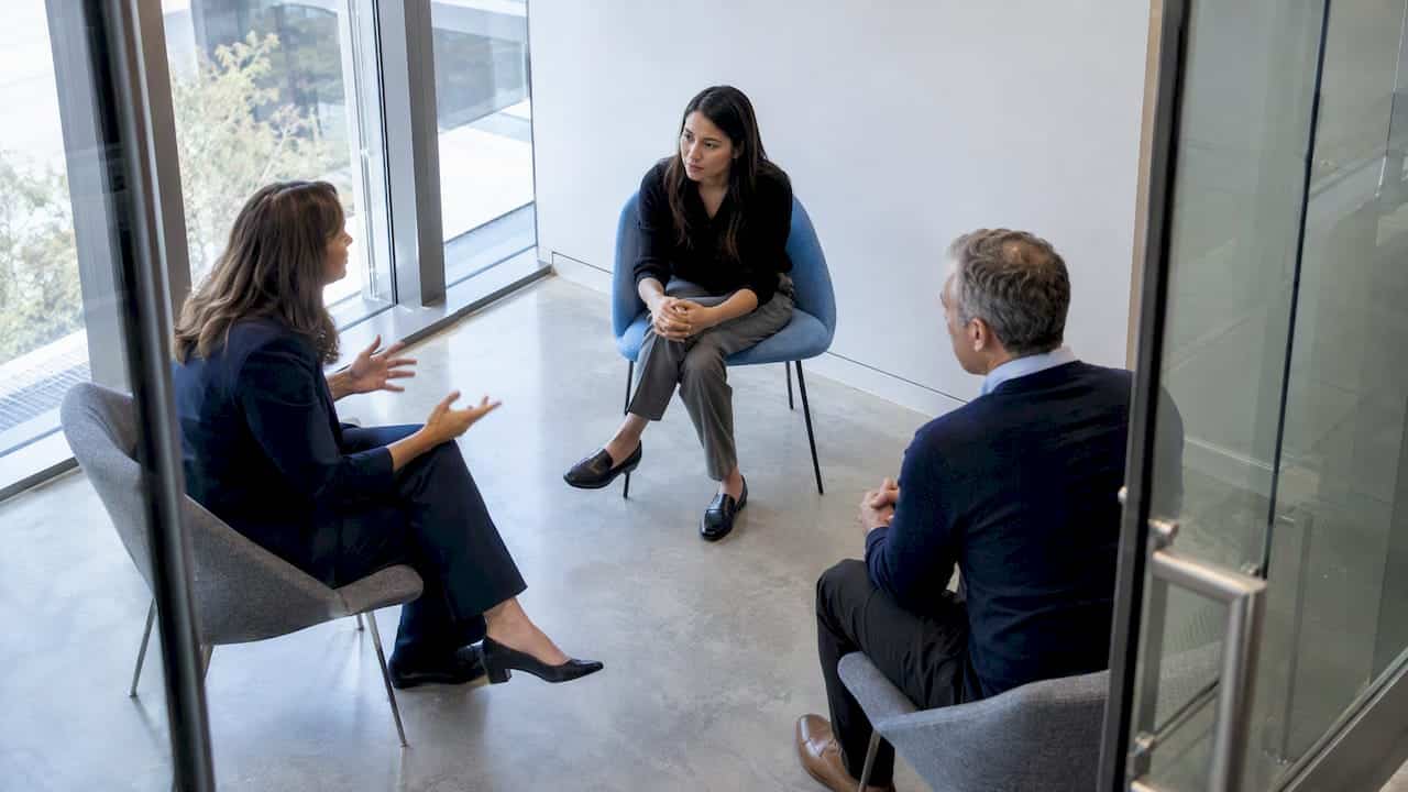 Candidate speaking with two hiring managers